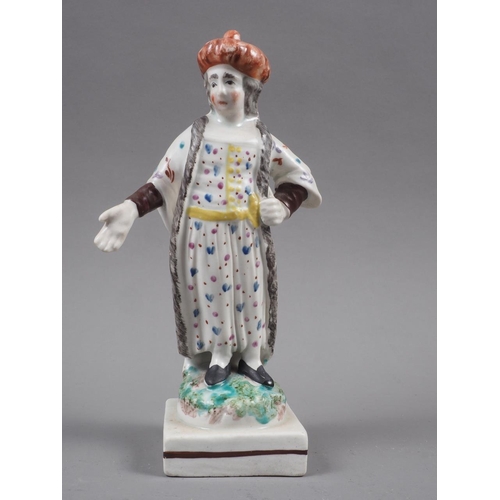 27 - An early 19th century Staffordshire polychrome decorated figure of a Turk, on square base, 6 1/4