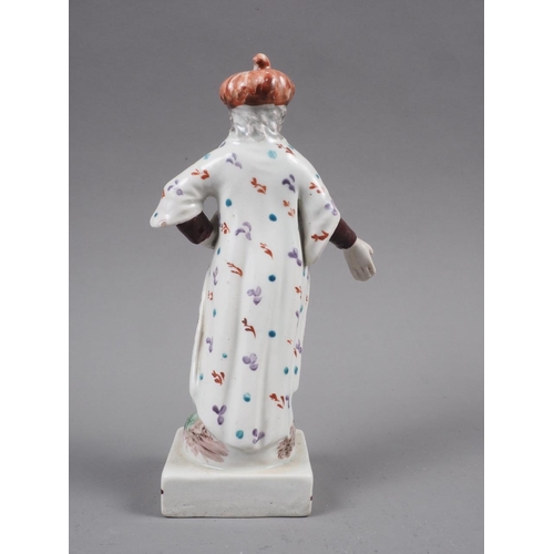 27 - An early 19th century Staffordshire polychrome decorated figure of a Turk, on square base, 6 1/4