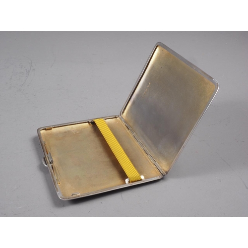 308 - An engine turned silver cigarette case, 4.3oz troy approx