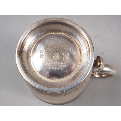 315 - A Garrard's engine turned silver christening mug and matching fork, in fitted case, 7.5oz troy appro... 