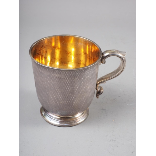 315 - A Garrard's engine turned silver christening mug and matching fork, in fitted case, 7.5oz troy appro... 