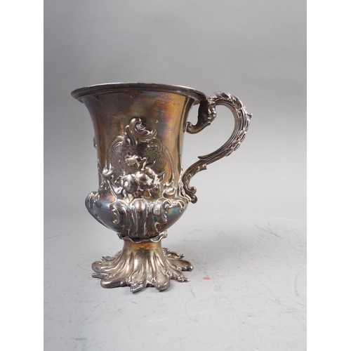 318 - A Georgian silver pedestal mug with embossed decoration, 4