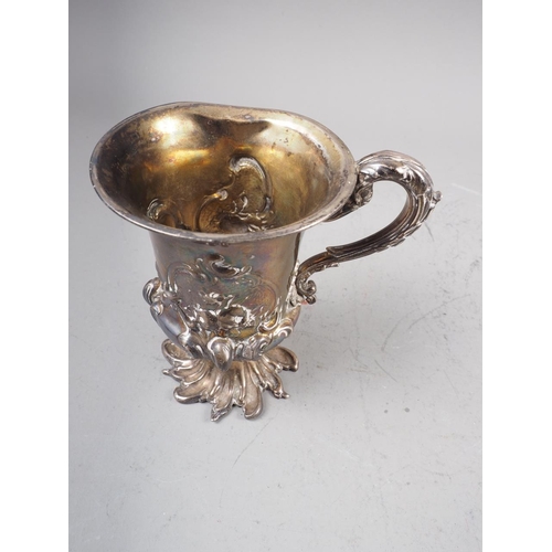 318 - A Georgian silver pedestal mug with embossed decoration, 4