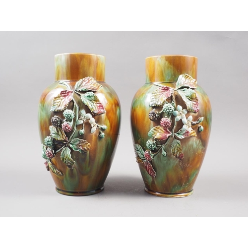 32 - A pair of 19th century Continental pottery vases with blackberry design relief, 9 3/4