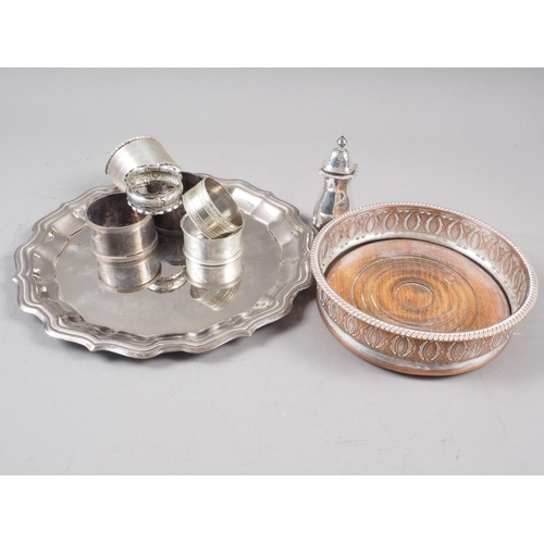 326 - Five silver napkin rings, 3.9oz troy, a silver plated on copper bottle coaster and other plate