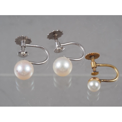 339 - A pair of white gold and pearl earrings, and a similar 9ct yellow gold and pearl earring