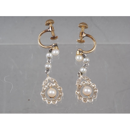 342 - A pair of yellow metal, seed pearl and diamond drop earrings