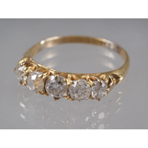 344 - An 18ct gold and diamond five stone dress ring, size Q, 2.6g