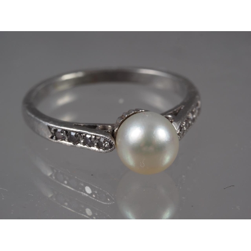 346 - A white metal, pearl and diamond dress ring, size G, 2.5g