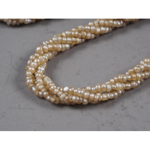 350 - A 19th century seed pearl multi-strand necklace and another similar