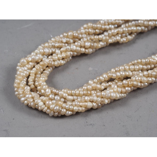 350 - A 19th century seed pearl multi-strand necklace and another similar