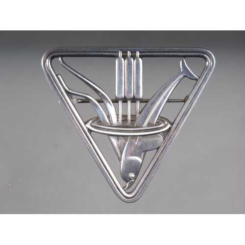 356 - A Georg Jensen silver brooch dolphin and bull rushes, in a triangle frame (257)