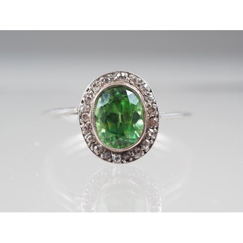 358 - A white metal ring, set demantoid garnet, 2ct approx, and rose diamond collar