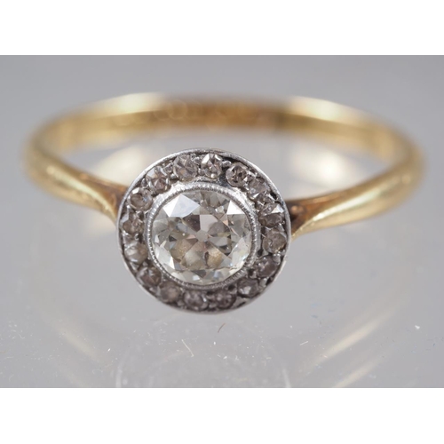 367 - An 18ct gold, platinum and diamond cluster ring, size P, 2.5g