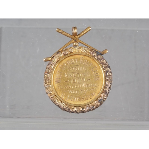 371 - A 9ct gold golfing medal, 9.9g