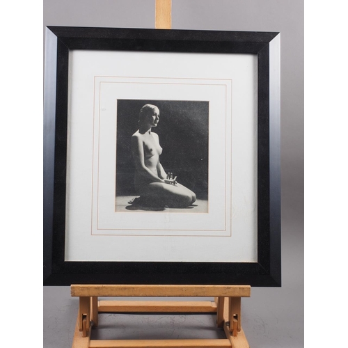 388 - A black and white print of a 1930s nude, in ebonised frame