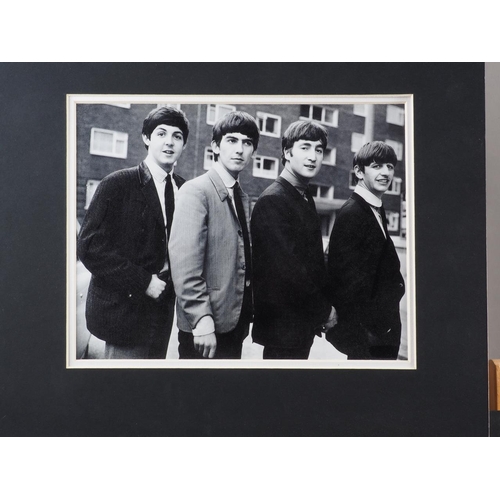 403 - A black and white photograph of the Beatles, unframed, another of James Dean, unframed, six framed p... 