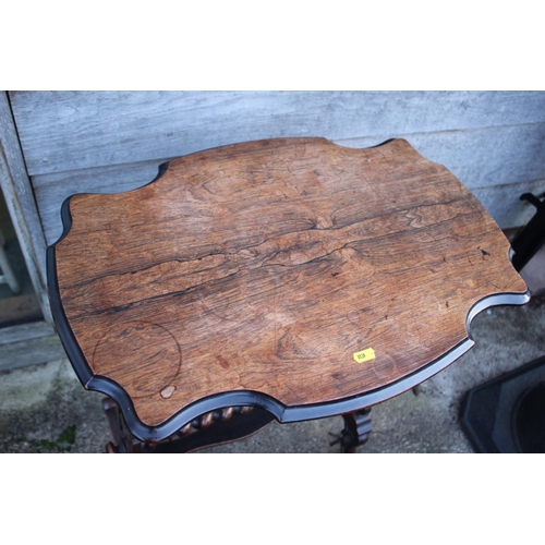 454 - A late 19th century rosewood shape top occasional table, on pierced panel end supports, united by a ... 