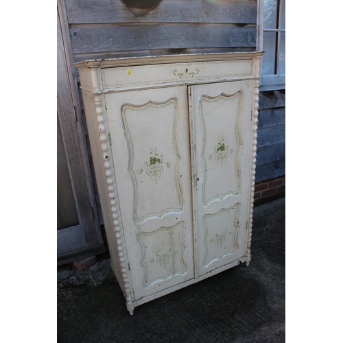 485 - A Continental painted cupboard enclosed two doors, on turned supports, 38