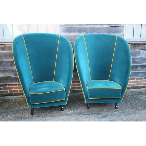 488 - A pair of deep seat arm easy chairs, upholstered in an azure velour with old gold piping, on ebonise... 