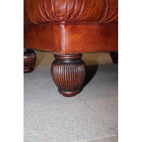 490 - A Tetrad button upholstered leather topped stool, on turned supports, 38