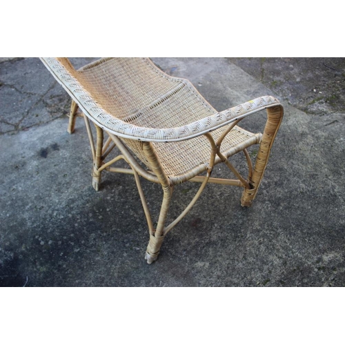 491 - A rattan two-seat settee with shaped seat rails, 42