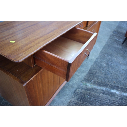 495 - A 1950s G Plan Librenza teak sideboard, fitted three drawers over two bi-fold doors, on ebonised spl... 