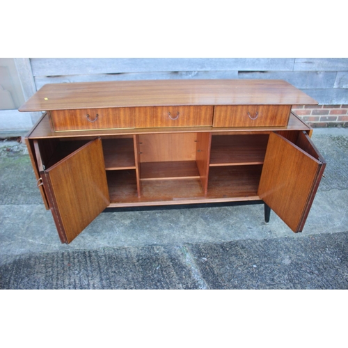 495 - A 1950s G Plan Librenza teak sideboard, fitted three drawers over two bi-fold doors, on ebonised spl... 