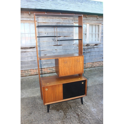 496 - A 1950s G Plan Librenza teak room divider with ebonised shelves over cocktail cabinet and cupboard e... 