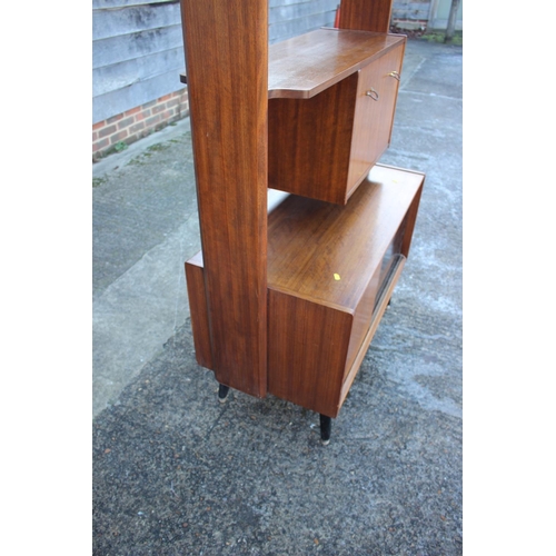 496 - A 1950s G Plan Librenza teak room divider with ebonised shelves over cocktail cabinet and cupboard e... 