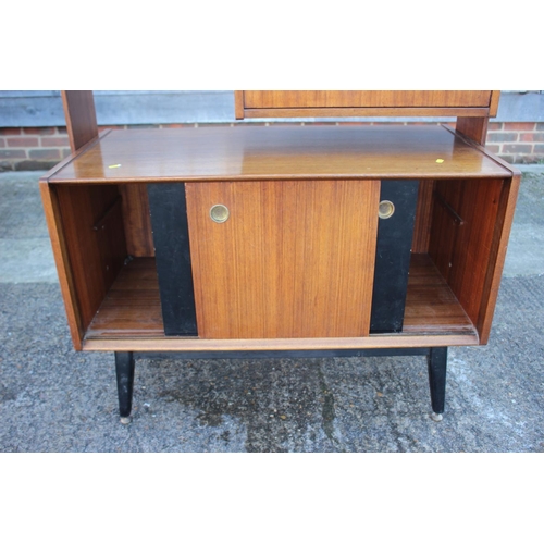 496 - A 1950s G Plan Librenza teak room divider with ebonised shelves over cocktail cabinet and cupboard e... 