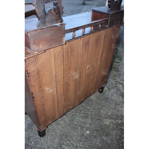 506 - A 1920s polished as walnut dressing chest, fitted mirror and two jewel drawers, over two small and t... 