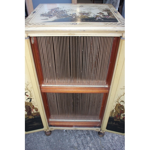 507 - A 1930s chinoiserie white lacquered and gilt decorated record cabinet with fitted interior enclosed ... 