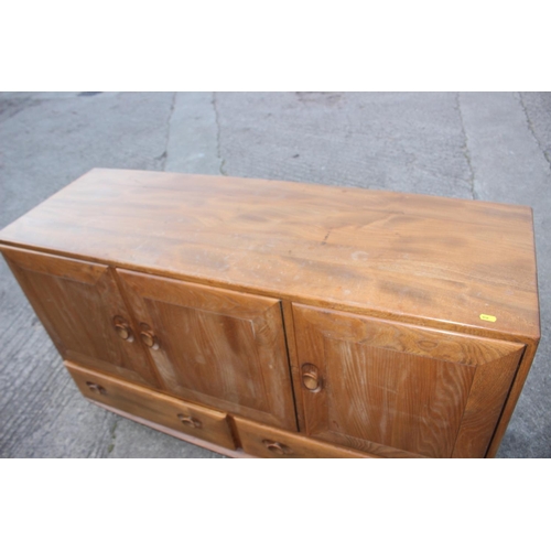 518 - A 1960s Ercol elm 429 sideboard, fitted three doors over two drawers, 52