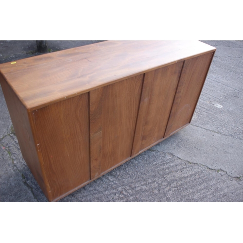 518 - A 1960s Ercol elm 429 sideboard, fitted three doors over two drawers, 52