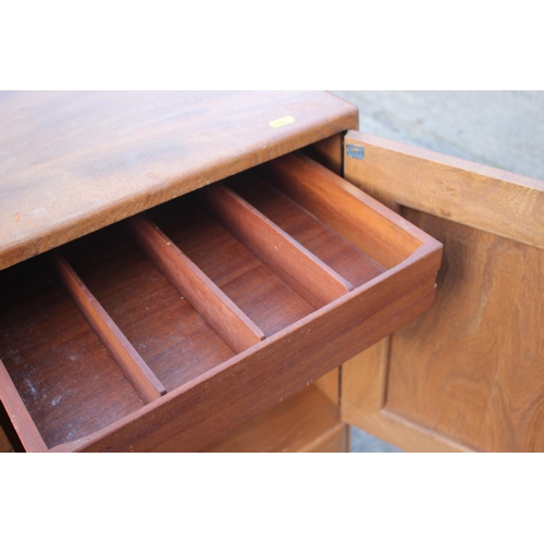 518 - A 1960s Ercol elm 429 sideboard, fitted three doors over two drawers, 52