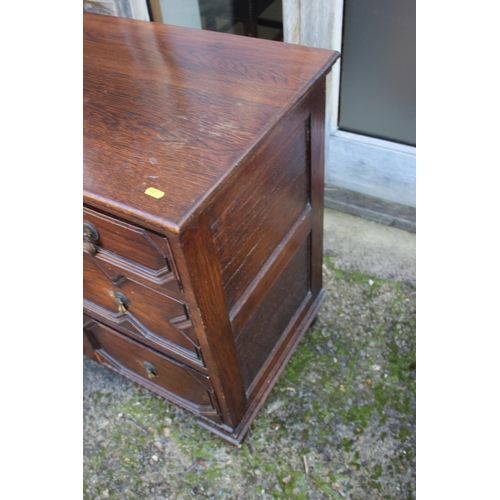 521 - An oak chest of two short and two long drawers of 17th century design with fielded panel fronts, on ... 