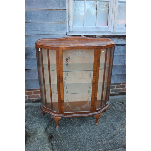 532 - A 1930s walnut shape front display cabinet enclosed one door, on cabriole supports, 40