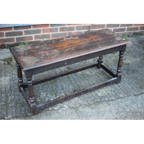 533 - An oak stool of 17th century design, on turned and stretchered supports, 38