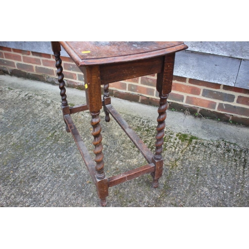 534 - An oak side table on barley twist stretchered supports, 30