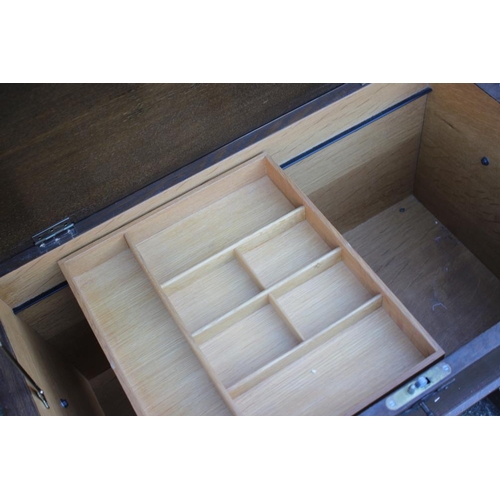 535 - An oak dough bin/sewing box with fitted interior, on panel end supports, 31