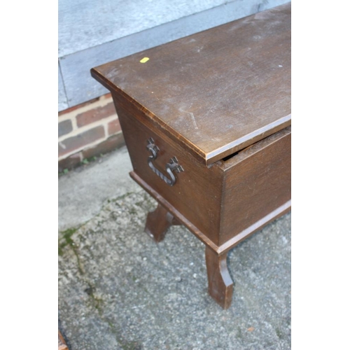 535 - An oak dough bin/sewing box with fitted interior, on panel end supports, 31