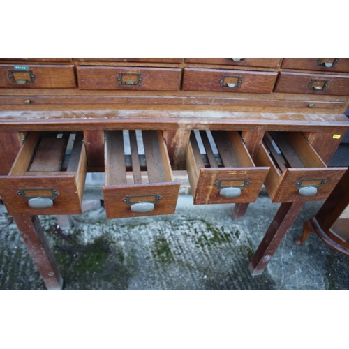 536 - An early 20th century nest of forty-eight filing drawers, on stand fitted four drawers, 43