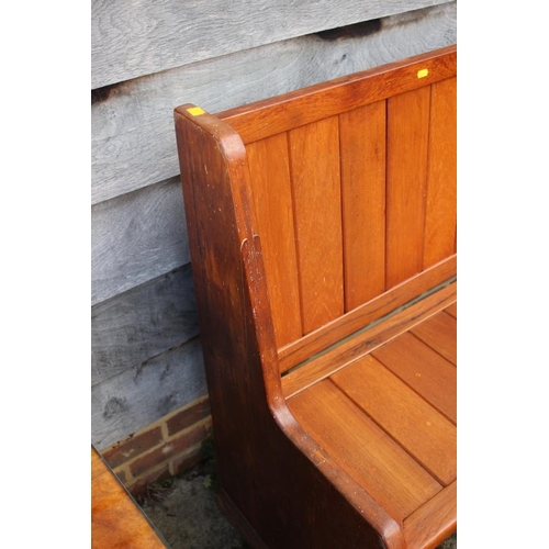 541 - An oak panel end bench/pew, 60