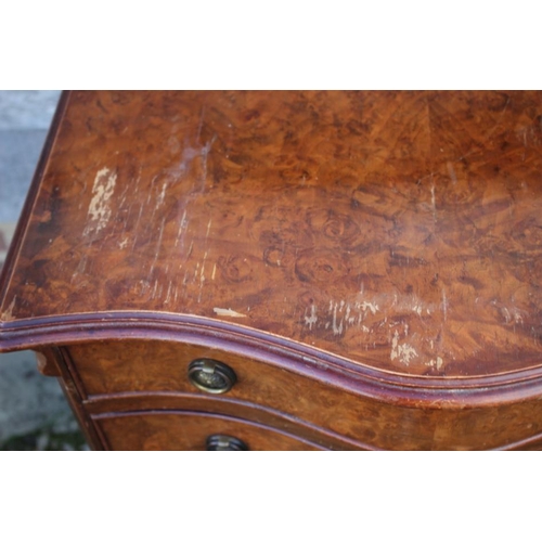 544 - A 1930s burr walnut serpentine front chest of four drawers with ring handles, on bracket feet, 24