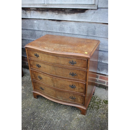 545 - A near pair of burr walnut and banded serpentine front chest of four long drawers, each 31