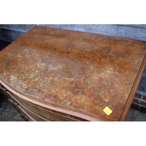 545 - A near pair of burr walnut and banded serpentine front chest of four long drawers, each 31