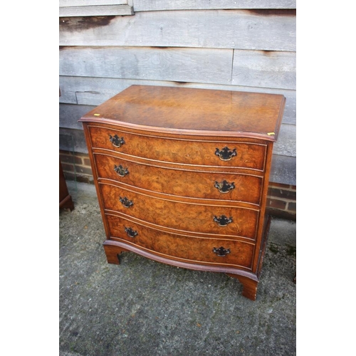 545 - A near pair of burr walnut and banded serpentine front chest of four long drawers, each 31