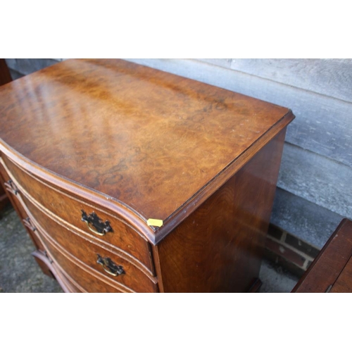 545 - A near pair of burr walnut and banded serpentine front chest of four long drawers, each 31