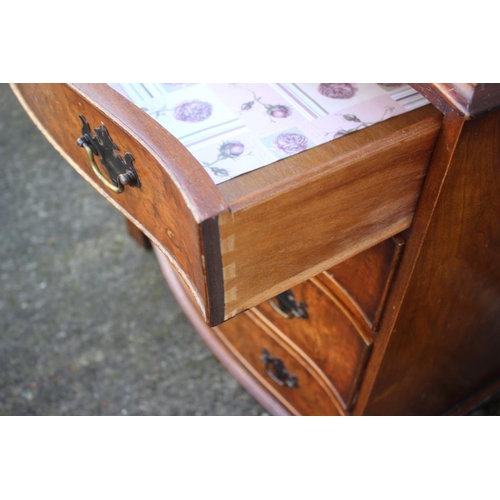 545 - A near pair of burr walnut and banded serpentine front chest of four long drawers, each 31